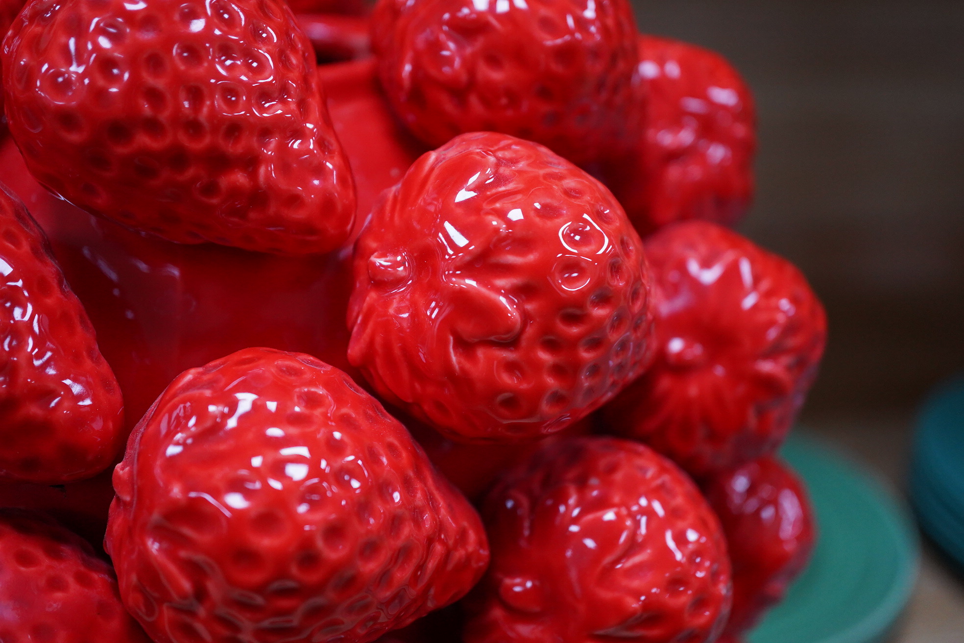 A pair of multi strawberry ceramic vases, 32cm high